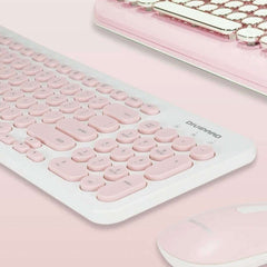 Pink keyboard with a matching mouse on a pink background