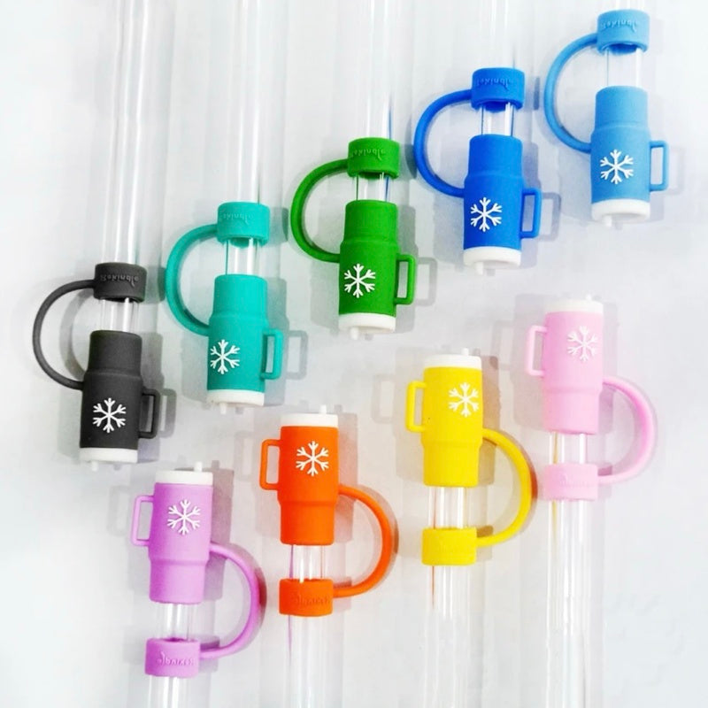 Colorful straw tips with snowflake design on a white background