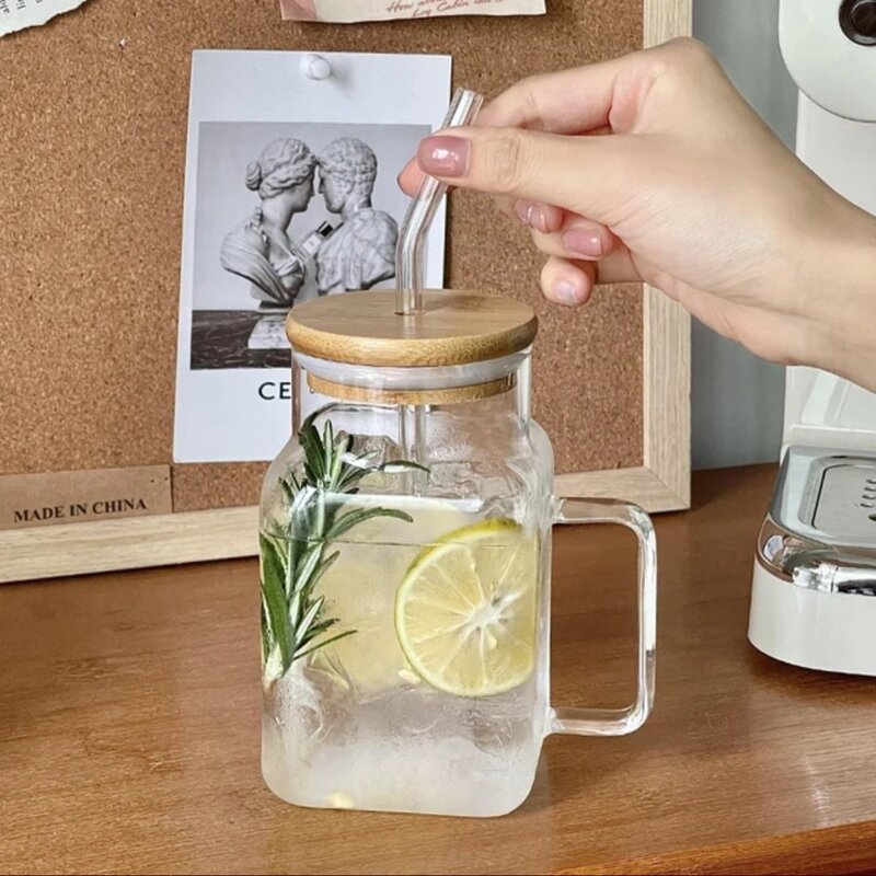 Glass jar with wooden lid and lemon slices on a wooden surface